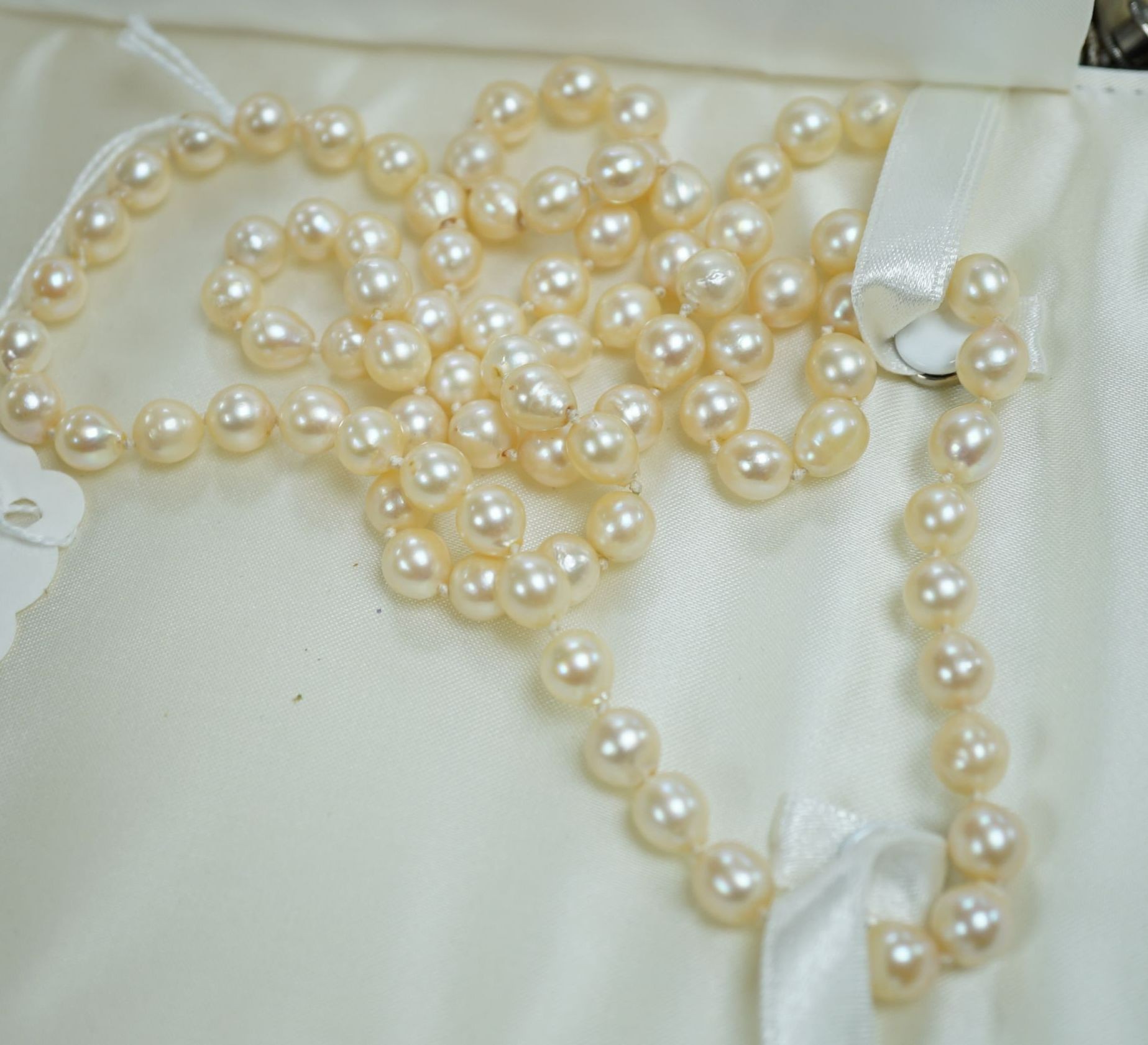 A quantity of assorted mainly costume jewellery etc. including cultured pearl necklace, white metal bangle and watches.